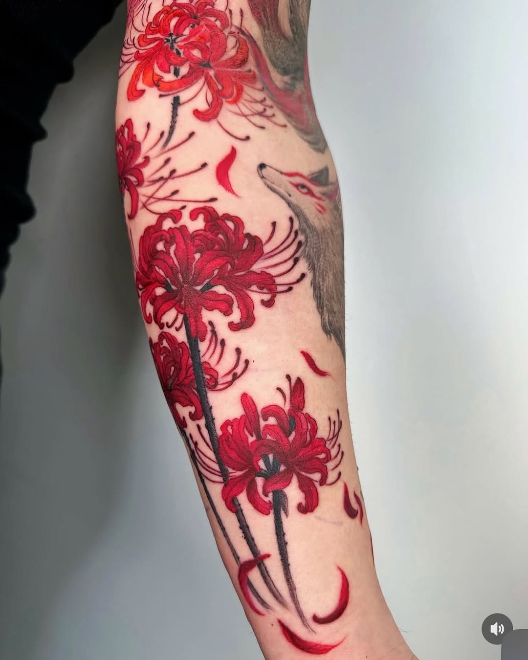 Shading is what brings the movement together.
Koi fish sleeve tattoo, Part 2
The fish, waves and blossoms all need different levels of contrast, but