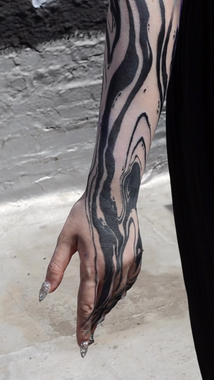 Three days, one sleeve and chest. Freehand blackwork in Denver.
Heavy black, abstract shapes, and a winged heart holding color right in the middle.