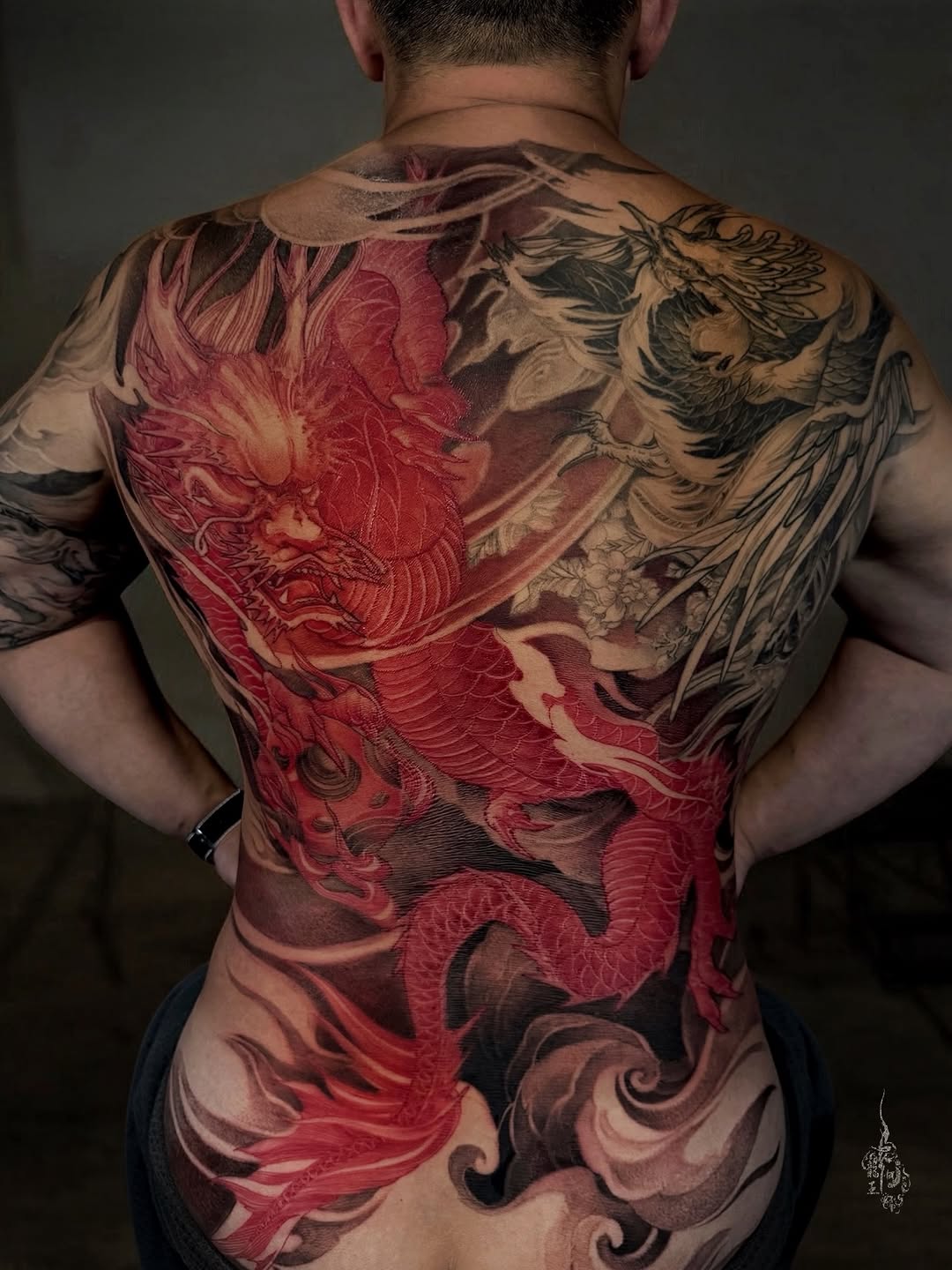 Red Dragon and rising Phoenix 🐉🦚. The phoenix was done 3 years ago, then a new dragon was added to unite it into one piece